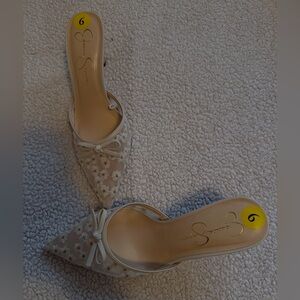Jessica Simpson white daisy heels with bow detailing.